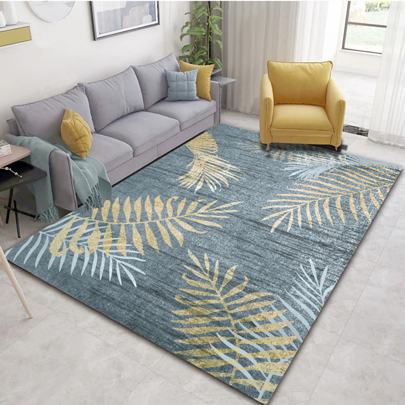 Dark blue base rug with gold botanical pattern, modern and stylish
