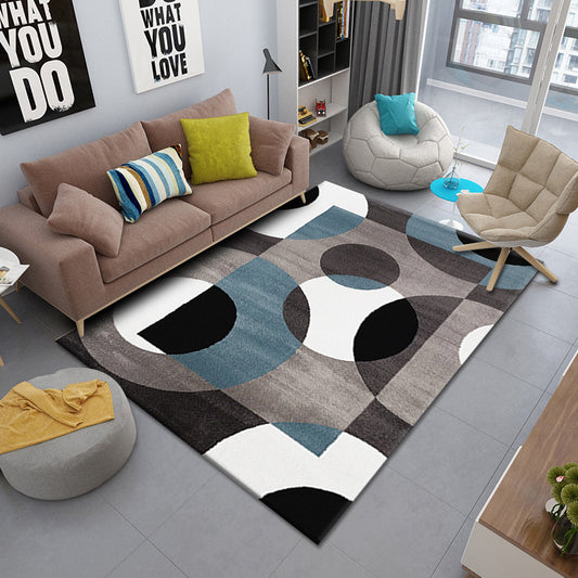 Dark brown, black, white, and dark blue circular pattern rug, modern and stylish