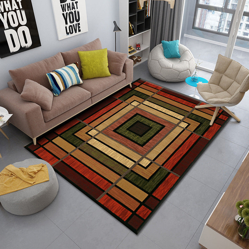 Living room with dark red, brown, dark grey, and dark green square and stripe patterned rug, modern decor