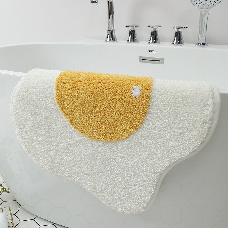 Angled view of poached egg bathroom mat for modern bathroom