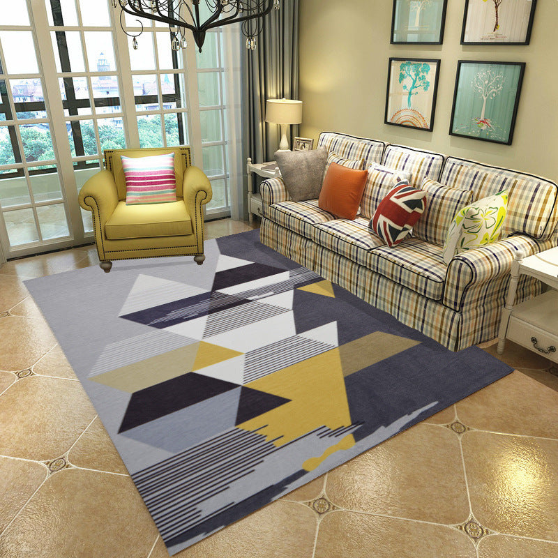 Grey, yellow, and white triangle pattern living room rug, modern and stylish