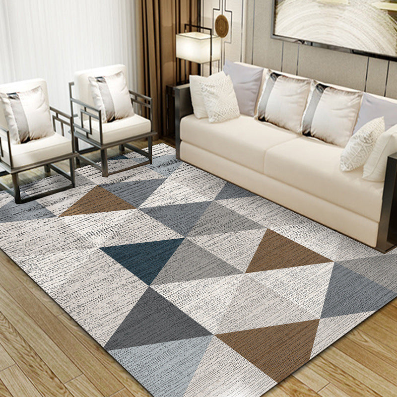 Dark blue, grey, light grey, brown, and white triangle pattern rug, modern and stylish