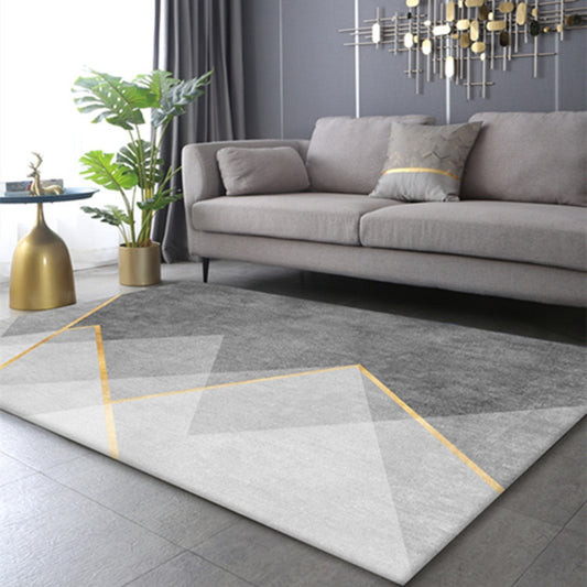 Dark grey and light grey triangle rug with gold striped line, modern and stylish